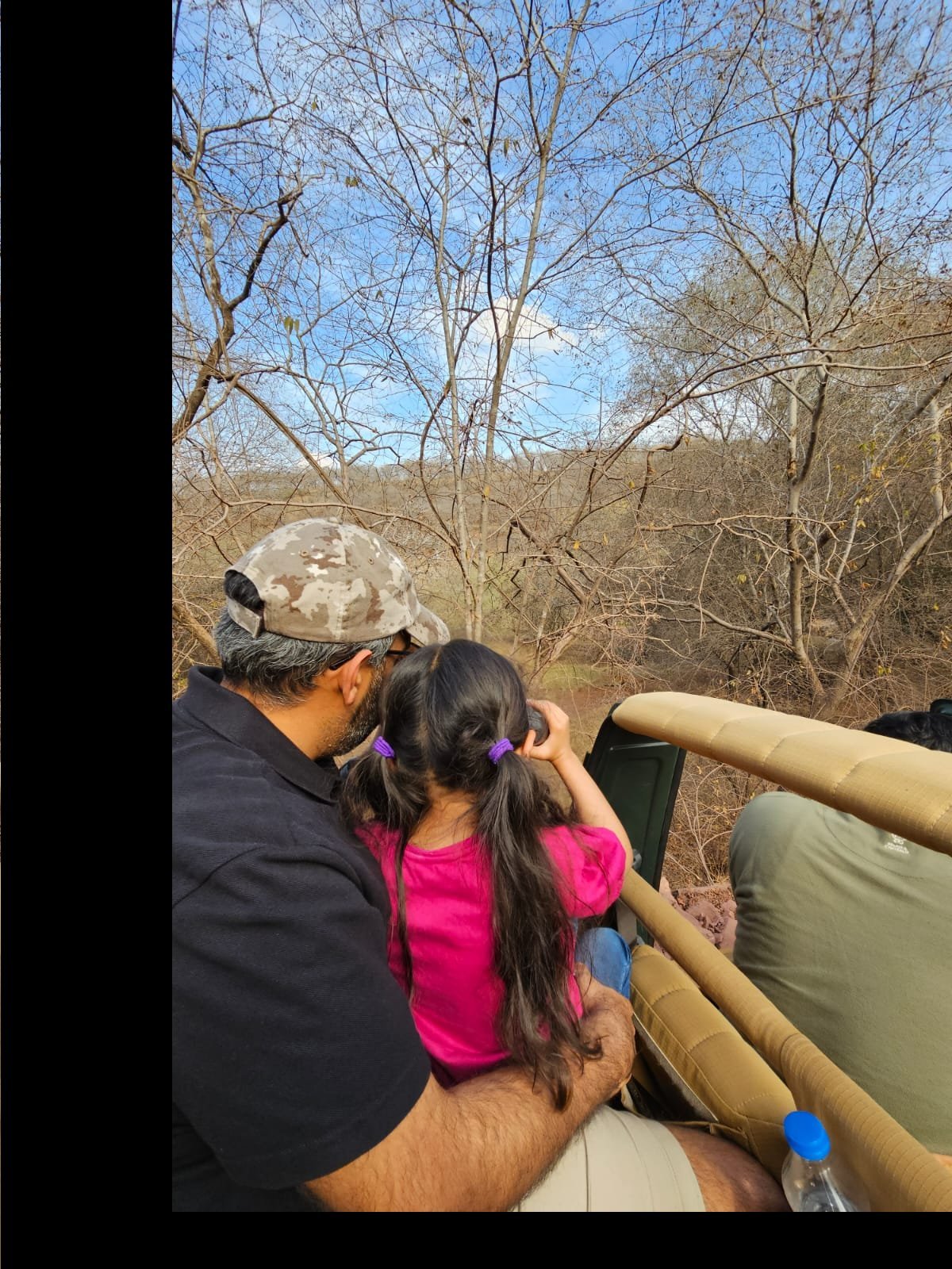 Father and daughter in jeep